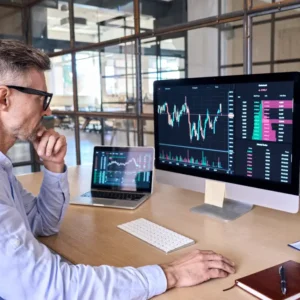 Man looking at analytics on desktop